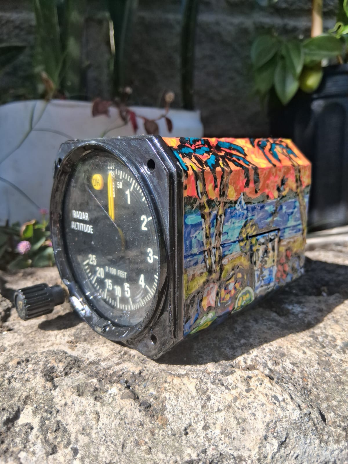 Radar altimeter from an aircraft cockpit, hand-painted with a tropical coastline